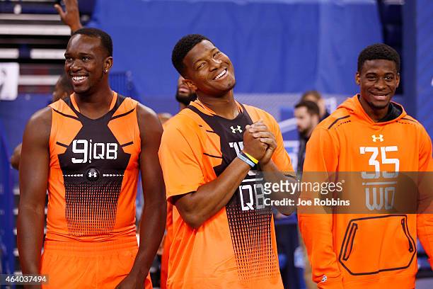 Quarterback Jameis Winston of Florida State jokes with quarterback Jerry Lovelocke of Prairie View A&M and wide receiver DeVante Parker of Louisville...