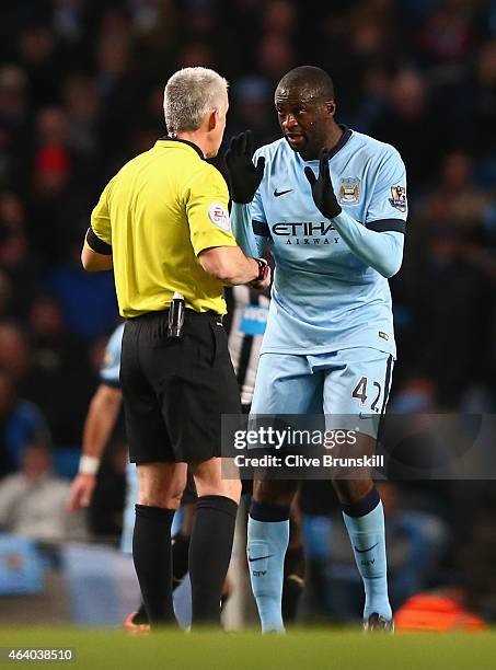 Yaya Toure of Manchester City speaks to Referee Chris Foy during the Barclays Premier League match between Manchester City and Newcastle United at...