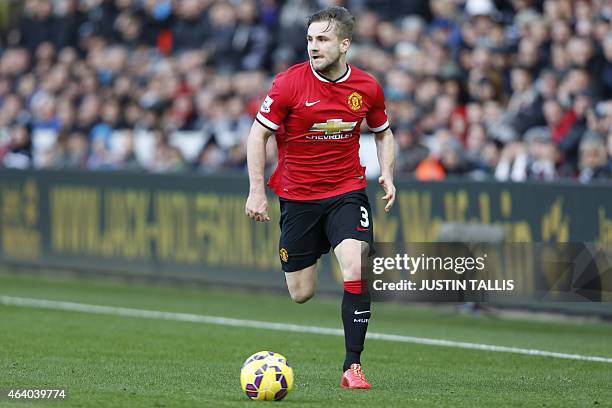 Manchester United's English defender Luke Shaw plays the ball during the English Premier League football match between Swansea and Manchester United...
