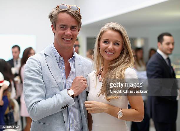 George Spencer-Churchill poses for a photograph with his girlfriend Camilla Thorp as they visit the Cartier Villa on the final day of the Cartier...