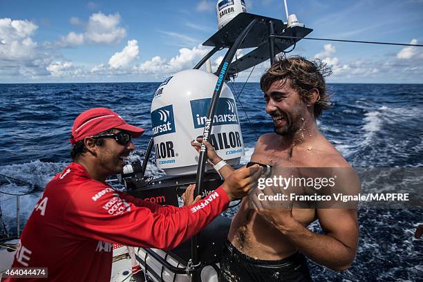 In this handout image provided by the Volvo Ocean Race onboard MAPFRE, Andre Fonseca shaving Willy Altadill's chest while crossing the Equator during...