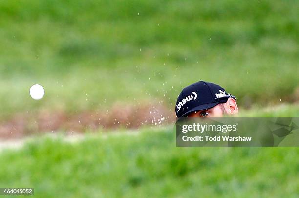 Graham DeLaet of Canada hits out of the bunker on the fourth hole on the fourth hole during round three of the Northern Trust Open at Riviera Country...