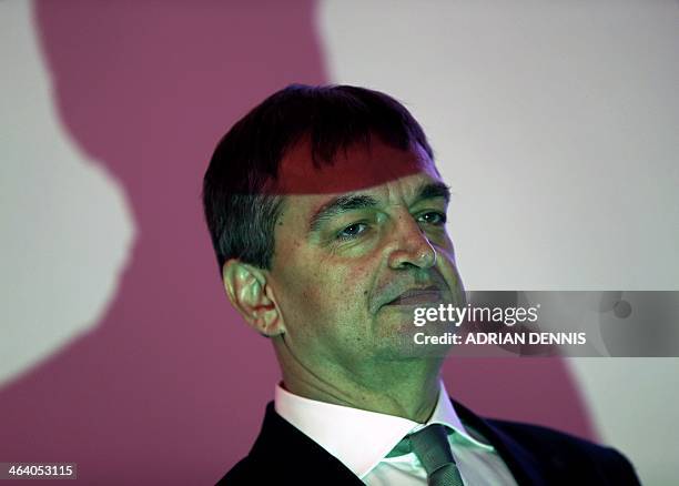 Former FIFA deputy general secretary Jerome Champagne stands in the light of a projector ahead of the Hope for Football press conference in London,...