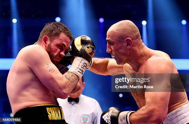 Arthur Abraham of Germany and Paul Smith of Great Britain exchange punches during the WBO World Championship Super Middleweight title fight at o2...