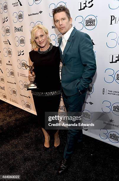 Actor Ethan Hawke poses in the press room with actress Patricia Arquettee, winner of the award for Best Supporting Female during the 2015 Film...