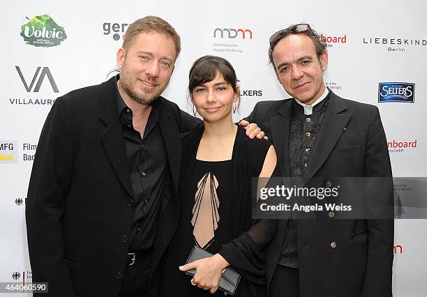 Juliano Ribeiro Salgado, Ivi Roberg and Laurent Petitgand attend the German Films and the Consulate General of the Federal Republic Of Germany's...