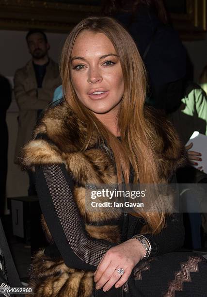 Lindsay Lohan attends the Gareth Pugh show during London Fashion Week Fall/Winter 2015/16 at Victoria & Albert Museum on February 21, 2015 in London,...