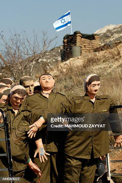 Dummies depicting Israeli soldiers are seen during the shooting of a movie telling the story of a member of Shiite movement Hezbollah, Amer Kalakesh,...