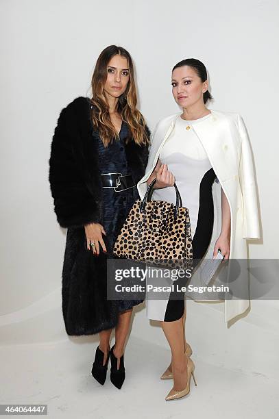 Aleksandra Melnichenko and a guest attend the Christian Dior show as part of Paris Fashion Week Haute Couture Spring/Summer 2014 on January 20, 2014...