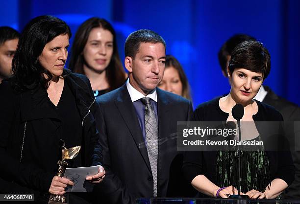Director Laura Poitras, journalist Glenn Greenwald, and producer Mathilde Bonnefoy accept Best Documentary for 'Citizenfour' onstage during the 2015...