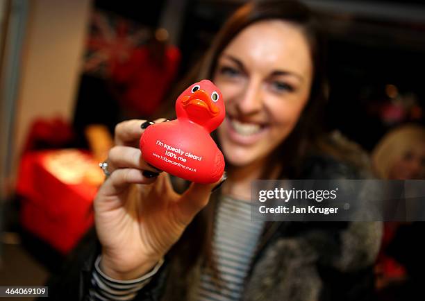 Jenna McCorkell of Great Britain poses with an anti doping soft toy during the Team GB Kitting Out ahead of Sochi Winter Olympics on January 20, 2014...