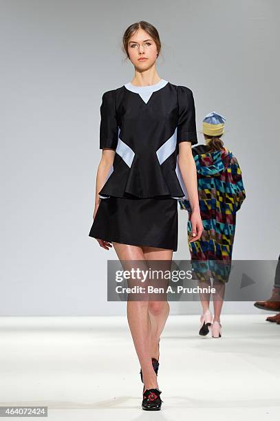 Model walks the runway in designs by Minju Kim at the Ones To Watch show during London Fashion Week Fall/Winter 2015/16 at Fashion Scout Venue on...