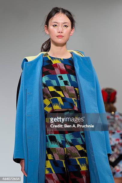 Model walks the runway in designs by Minju Kim at the Ones To Watch show during London Fashion Week Fall/Winter 2015/16 at Fashion Scout Venue on...