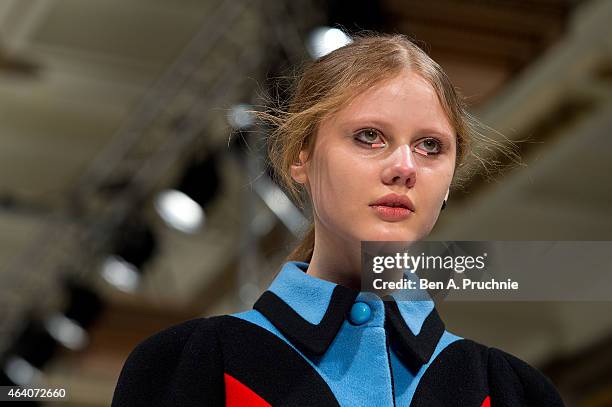 Model walks the runway in designs by Minju Kim at the Ones To Watch show during London Fashion Week Fall/Winter 2015/16 at Fashion Scout Venue on...