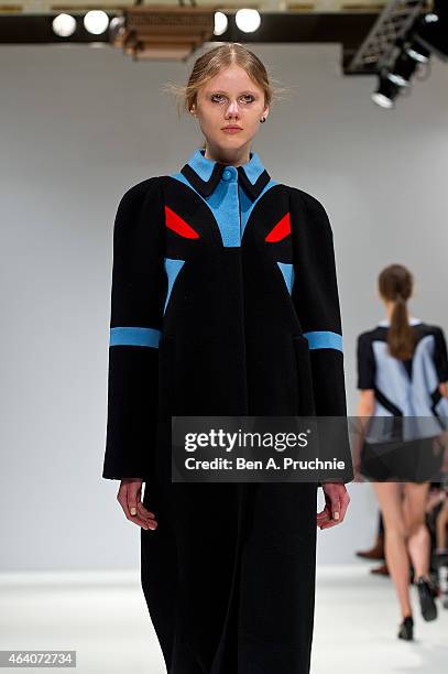 Model walks the runway in designs by Minju Kim at the Ones To Watch show during London Fashion Week Fall/Winter 2015/16 at Fashion Scout Venue on...