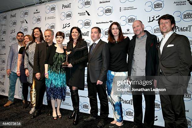 Dirk Wilutzky , Mathilde Bonnefoy , Laura Poitras , Glenn Greenwald and the cast and crew of "Citizenfour" pose in the press room with the award for...