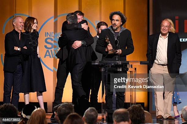 Director Alejandro Gonzalez Inarritu accepts Best Feature for 'Birdman' onstage with actors Michael Keaton and Emma Stone and producer Arnon Milchan...