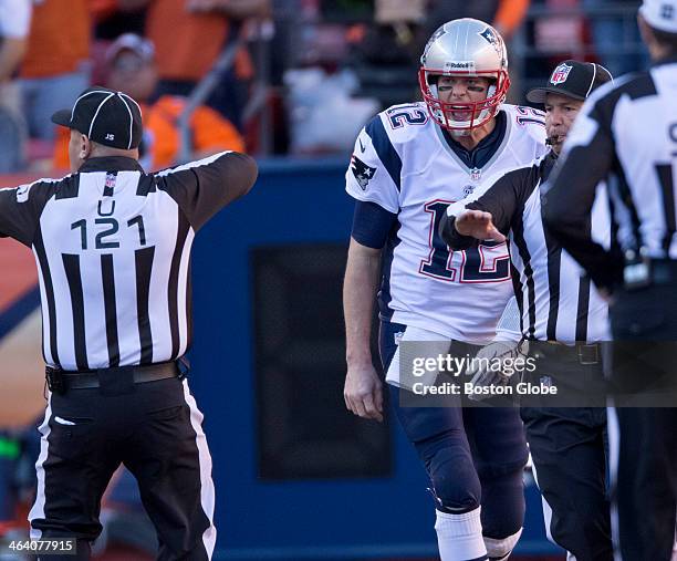 New England Patriots quarterback Tom Brady expresses his anger at the officials after his pass was tipped at the line of scrimmage against the Denver...