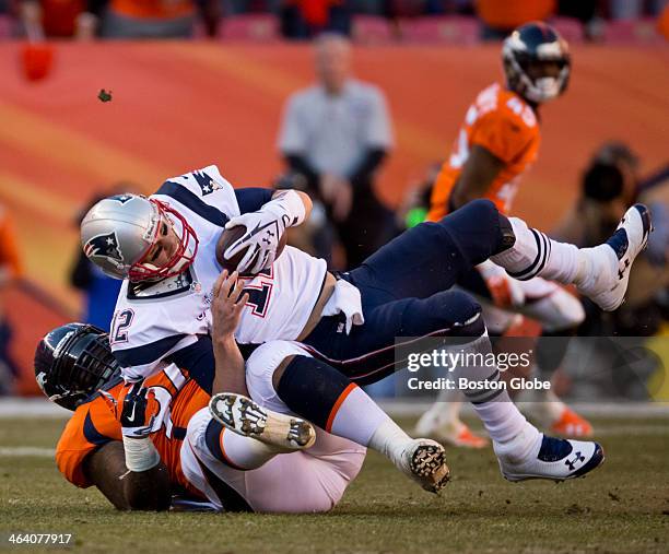 New England Patriots quarterback Tom Brady is sacked by the Denver Broncos' Terrance Knighton on a fourth down and three yards to go during third...