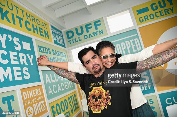 Aarón Sánchez and carla Hall pose at the KitchenAid Culinary Demonstrations during the 2015 Food Network & Cooking Channel South Beach Wine & Food...