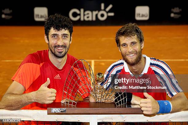 Philipp Oswald of Austria and Martin Klizan of Slovakia pose for photographers after defeating Pablo Andujar and Oliver Marach to win the doubles...