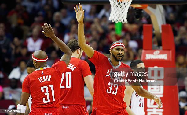 Corey Brewer and Jason Terry of the Houston Rockets celebrate after a basket during their game against the Toronto Raptors at the Toyota Center on...