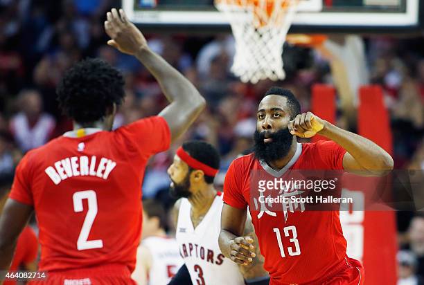 James Harden and Patrick Beverley of the Houston Rockets celebrate after a basket during their game against the Toronto Raptors at the Toyota Center...
