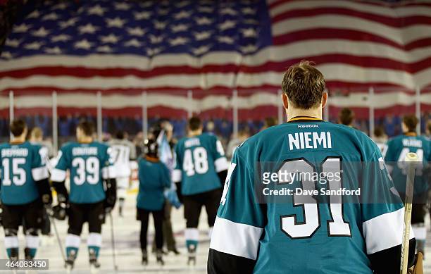 Goaltender Antti Niemi of the San Jose Sharks stands on the ice during the national anthem before the start of the 2015 Coors Light NHL Stadium...