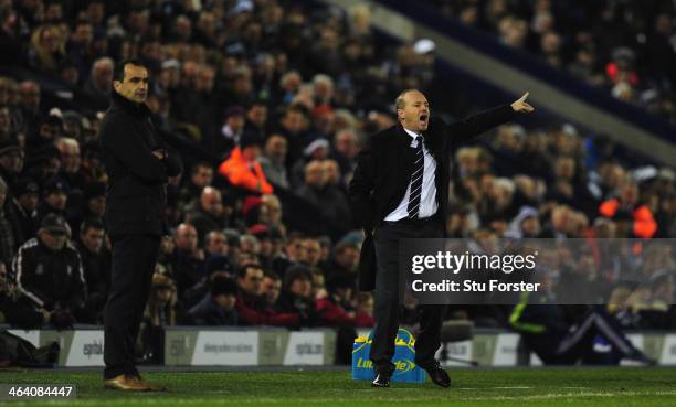 New West Brom manager Pepe Mel reacts alongside Everton manager Roberto Martinez during the Barclays premier league match between West Bromwich...