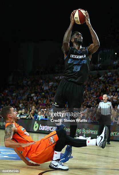 Ekene Ibekwe of the Breakers drives to the basket as Scottie Wilbekin of the Taipans falls over during the round 22 NBL match between New Zealand...