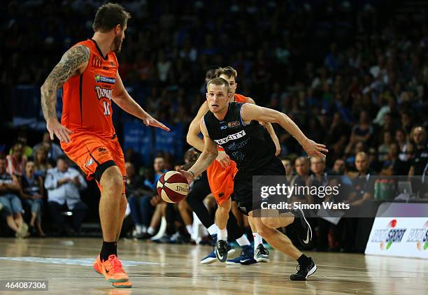 Rhys Carter of the Breakers dribbles the ball during the round 22 NBL match between New Zealand Breakers and the Cairns Taipans at Vector Arena on...