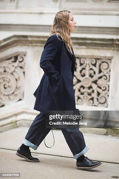 Shelley Down wears E. Tautz jacket and pants, Paul Smith shoes, and an Alexander McQueen bag during London Fashion Week Fall/Winter 2015/16 at the...