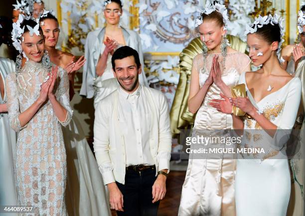 French fashion designer Alexis Mabille acknowledges the public during his Haute Couture Spring-Summer 2014 collection show, on January 20, 2014 in...
