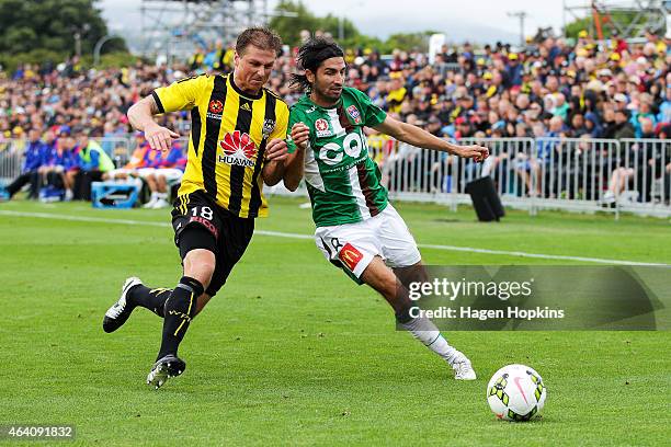 Ben Sigmund of the Phoenix and Zenon Caravella of the Jets compete for the ball during the round 18 A-League match between Wellington Phoenix and...