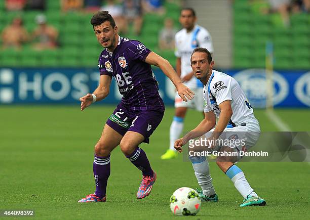 Dragan Paljic of Perth Glory and Massimo Murdocca of Melbourne City compete for the ball during the round 18 A-League match between Melbourne City FC...