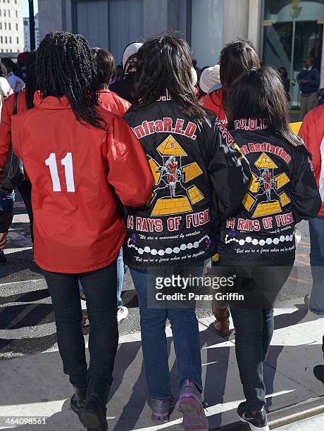 Members of Delta Sigma Theta Sorority, Inc. Lock arms together to participates in the 2014 Martin Luther King, Jr. March & Rally at Peachtree Street...