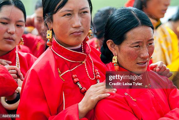 Khampa women, dressed in ceremonial clothes, at the Yushu Horse Racing Festival in Qinghai. Otherwise known as Yaji- the Festival of Summer...