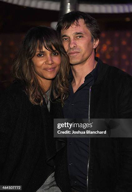 Halle Berry and Olivier Martinez attend the Treats! Magazine Pre-Oscar Party at the Treats! Villa presented by OMNIA on February 21, 2015 in Los...