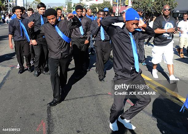 Young men dance during the Martin Luther King Jr. Parade in Los Angeles, California on January 20, 2014. The 29th annual Kingdom Day Parade honoring...