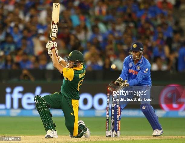 Morne Morkel of South Africa is bowled out by Ravichandran Ashwin as wicketkeeper MS Dhoni of India looks on during the 2015 ICC Cricket World Cup...