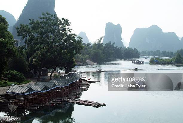 Bamboo rafts await passengers on the Yulong River in Yangshuo. Speckled with karst mountains and the gently flowing rivers, this region outside...