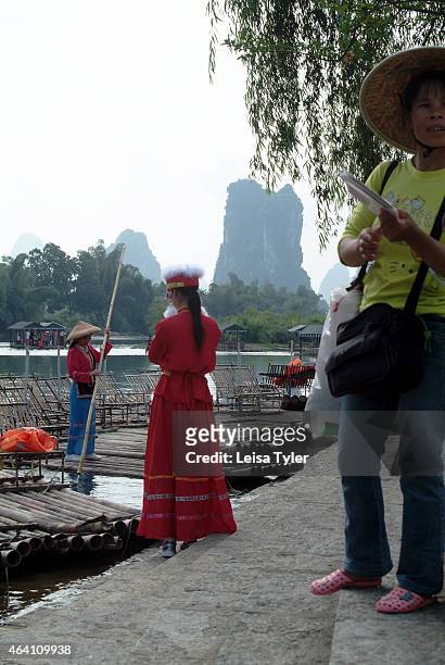 Tourists dress up as local village girls in Yangshou, a region of karst mountains and the gently flowing Li River outside of Guilin. The last years...