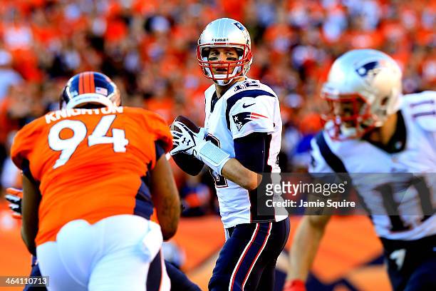 Tom Brady of the New England Patriots in action against the Denver Broncos during the AFC Championship game at Sports Authority Field at Mile High on...