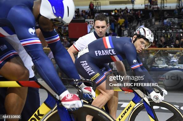 France's Francois Pervis , flanked by his coach Franck Durivaux, and