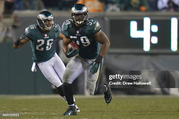 DeMeco Ryans of the Philadelphia Eagles returns an interception against the New Orleans Saints at Lincoln Financial Field on January 4, 2014 in...