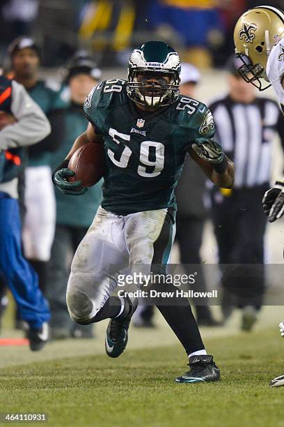 DeMeco Ryans of the Philadelphia Eagles returns an interception against the New Orleans Saints at Lincoln Financial Field on January 4, 2014 in...