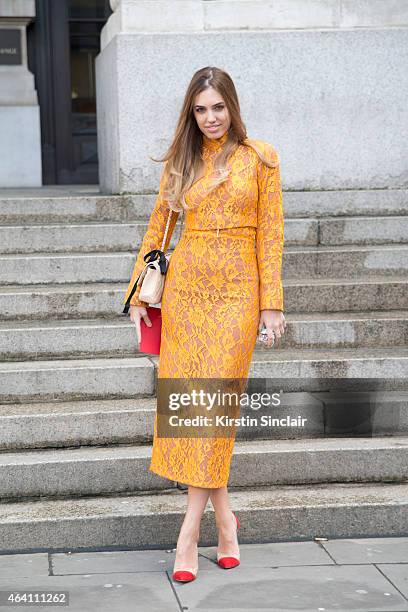 Modela and DJ Amber Le Bon wears an Emilia Wickstead dress, Chanel bag and Gianvitto Rossi shoes on February 21, 2015 in London, England.