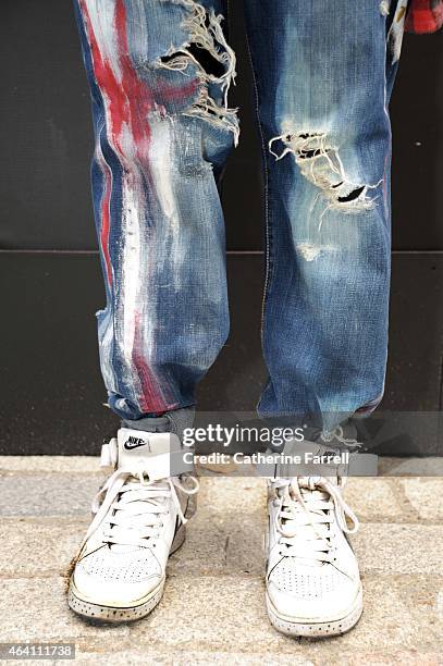 Musician Danny Ryder wearing independent label JEANS UK jeans and customised Air Force 1 trainers during London Fashion Week Fall/Winter 2015/16 at...
