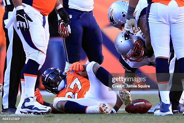 Knowshon Moreno of the Denver Broncos lays on the ground after a run against the New England Patriots during the AFC Championship game at Sports...