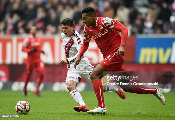 Alessandro Schoepf of 1. FC Nuernberg and Jonathan Tah of Fortuna Duesseldorf chase the ball during the Second Bundesliga match between Fortuna...